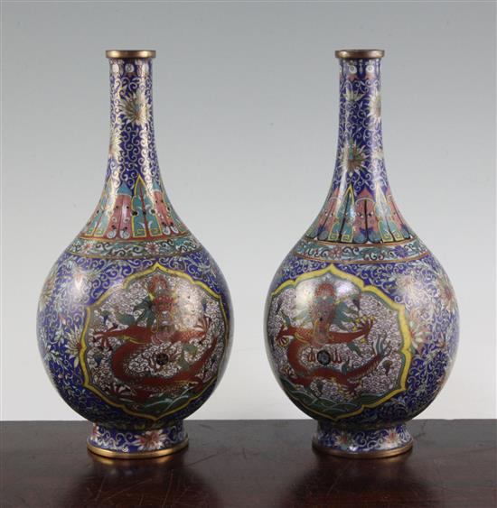 A pair of Chinese cloisonne enamel dragon bottle vases, early 20th century, 25.5cm